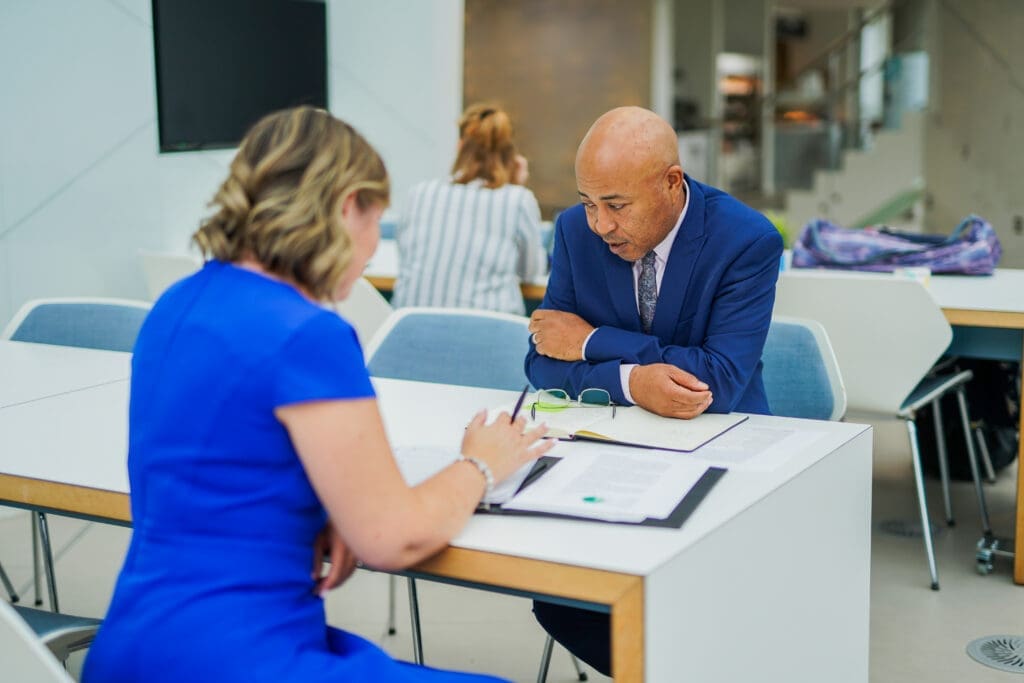 Colleagues at table for work meeting