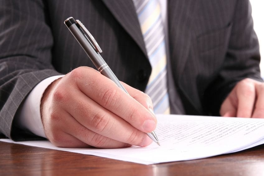 A person signing a document