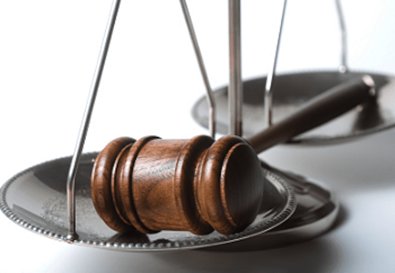 A judge's hammer and scales of justice