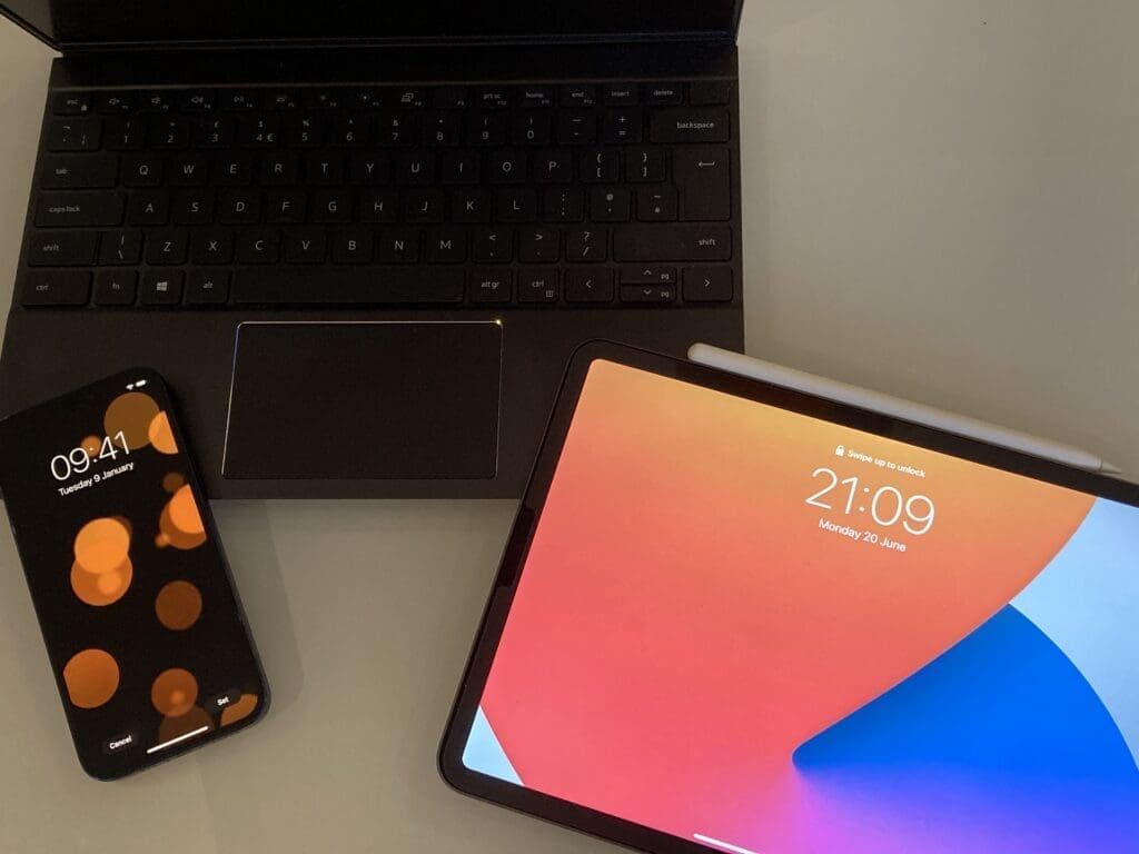 A laptop, a phone and a tablet.