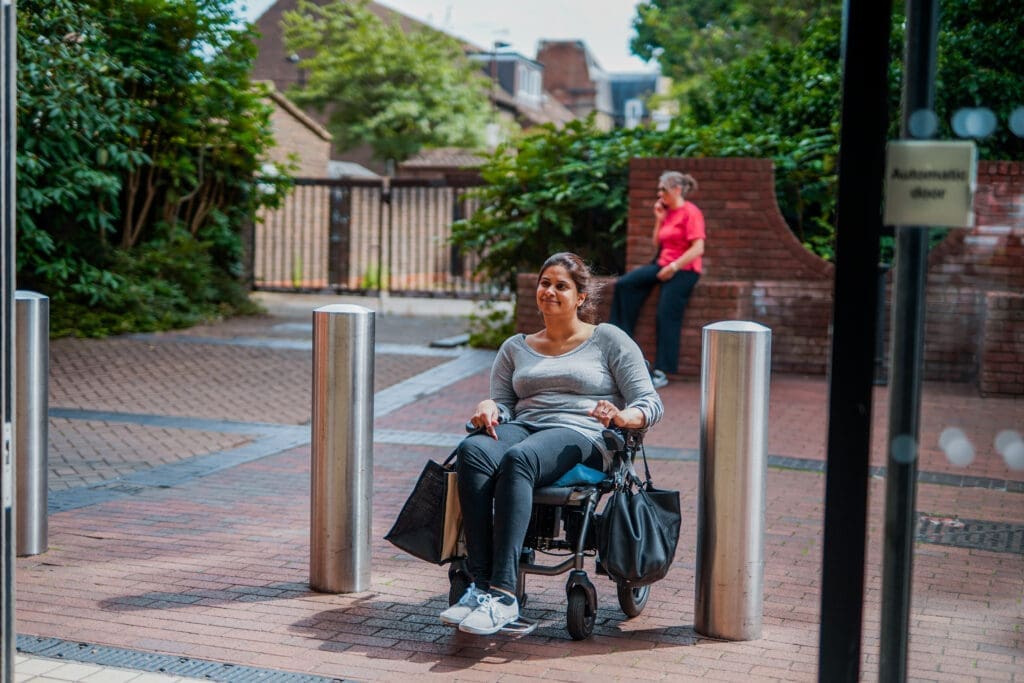 Wheelchair user enters a shop