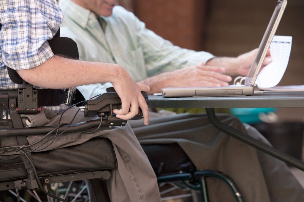 An assistive tech user uses a laptop