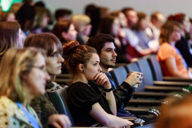 Audience sitting at a conference.