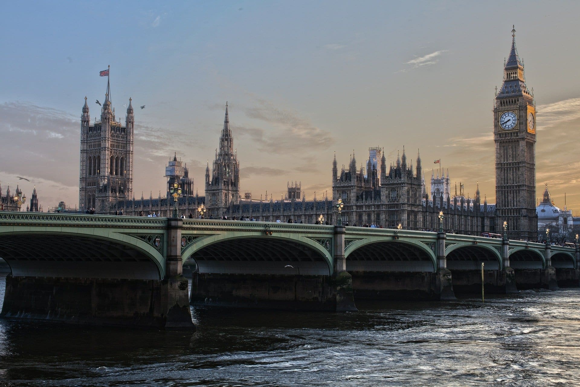 Government-network View of Westminster Bridge, Big Ben and the Houses of Parliament at dusk.