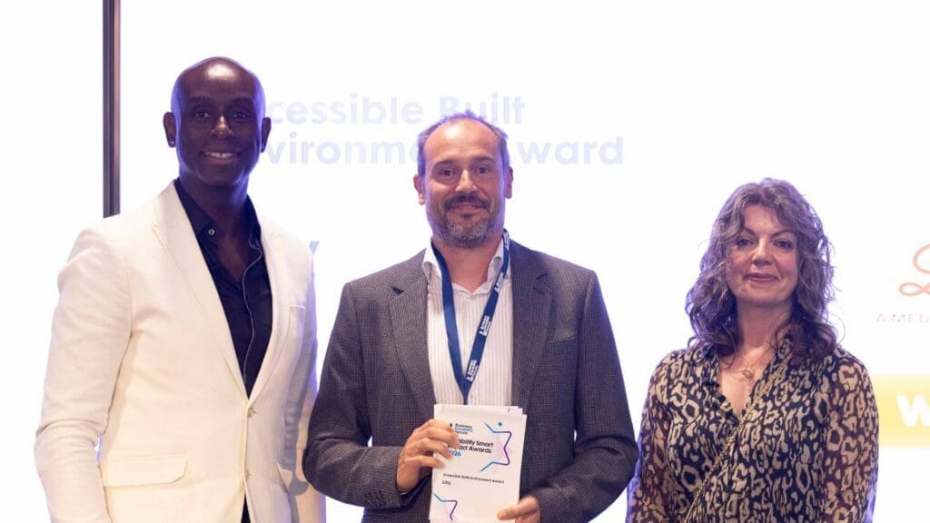 Accessible Built Environment Award presented to Lilly representative on stage in 2026.